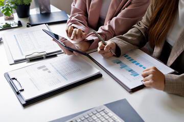 Focused accountant analyzing office documents for valuation accuracy