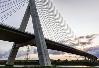 Flintshire Bridge stands prominently in the soft light of early morning, with its cables and concrete structure leading into the distance