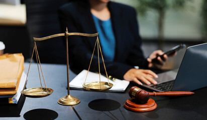female business woman lawyers working at the law firms. Judge gavel with scales of justice. Legal law, lawyer, documents, advice and justice concept.