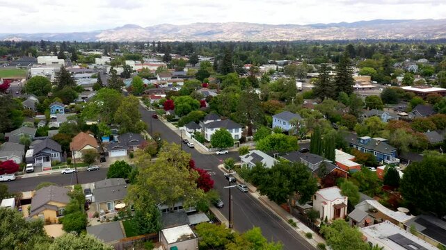 Angled overview orbit of Napa suburban neighborhood under overcast sky, quiet peaceful typical homes