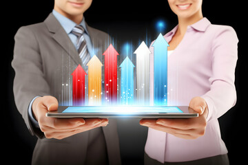 Two business professionals holding a tablet projecting colorful upward arrows symbolizing growth and success.