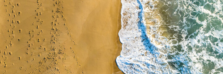 Florianópolis, Campeche beach during sunrise. Brazil. Rio Tavares neighborhood. Wave formation in web banner.