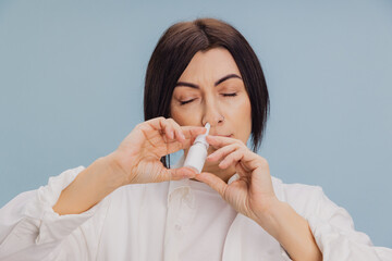 Woman Using Nasal Spray for Health Relief