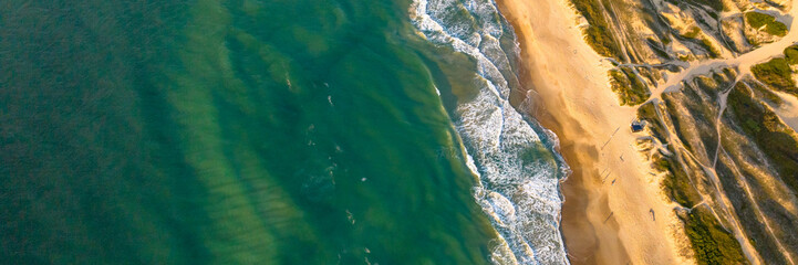 Florianópolis, Campeche beach during sunrise. Brazil. Rio Tavares neighborhood. Wave formation in web banner.