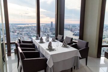 Interior of luxury restaurant in a classic style with panoramic windows