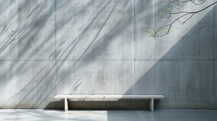 A sleek, minimalist concrete bench rests against a textured gray wall, showcasing modern design elements that emphasize simplicity and elegance in contemporary architecture.