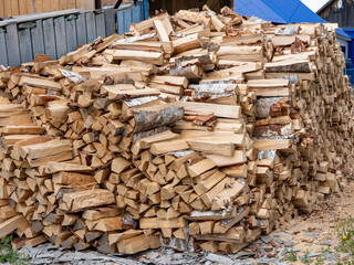 A pile of wood logs stacked on top of each other
