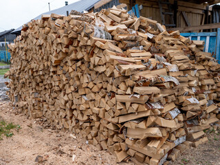 A pile of wood logs stacked on top of each other