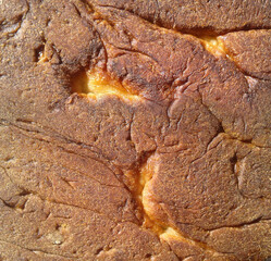 Bottom of fresh wheat bread. View texture food  baking the product. Close-up.
