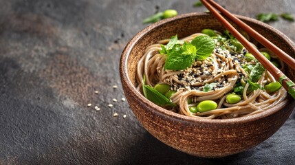Foods reduce stroke risk. Delicious bowl of noodles garnished with mint and sesame seeds, served with chopsticks.