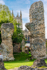 A view between the Abbey ruins in the Abbey Gardens at Bury Saint Edmunds on a bright day in springtime