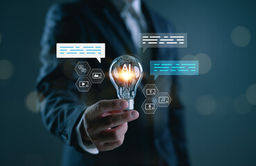 AI creative innovation concept with businessman holding light bulb, showing artificial intelligence powering text, image, video and audio generation in modern digital content.