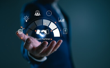 Trust partnership concept with businessman holding digital handshake icon, representing reliable cooperation, strategic success, long-term business relationships, B2B marketing, consulting.