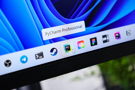 Poznan, Poland - June 6, 2025: PyCharm Professional application icon highlighted by a mouse cursor on the modern Windows 11 taskbar, showcasing a cutting-edge software development environment