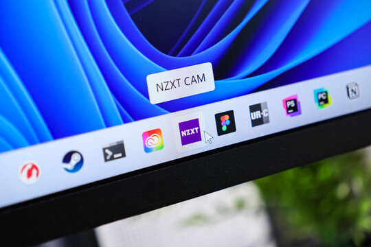 Poznan, Poland - June 6, 2025: NZXT CAM application tooltip visible on a Windows 11 desktop taskbar, highlighting modern computer system software management