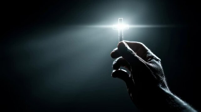 Shadowy silhouette of a persons hand reaching out to hold a glowing cross, symbolizing the guiding light of faith in the darkness.