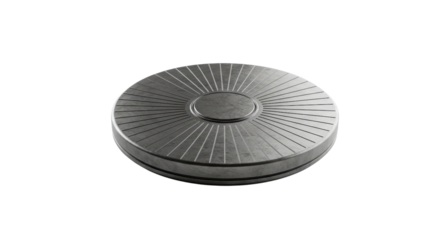 Round black cast iron trivet with radial pattern isolated on white