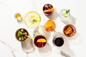Alcohol cocktail drinks at white background.