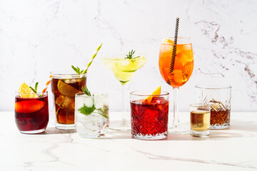 Alcohol cocktail drinks at white background.