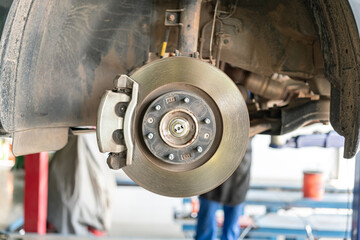 Car wheel disc brake and caliper part that disassembled from inspection. Vehicle equipment part...