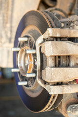 Car wheel disc brake and caliper part that disassembled from inspection. Vehicle equipment part...