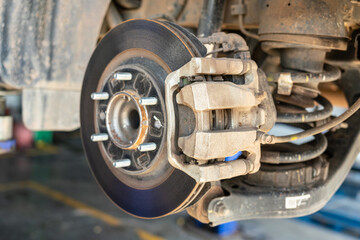 Car wheel disc brake and caliper part that disassembled from inspection. Vehicle equipment part...