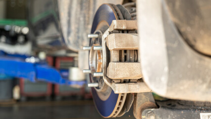 Car wheel disc brake and caliper part that disassembled from inspection. Vehicle equipment part...