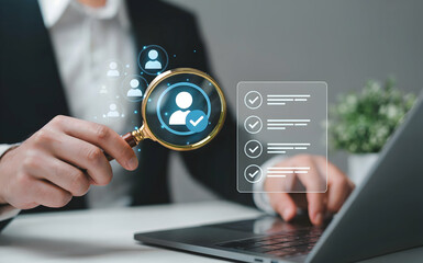 A businessman uses a magnifying glass to meticulously review a verified profile on a laptop, signifying thorough candidate assessment and recruitment process efficiency for optimal team building.