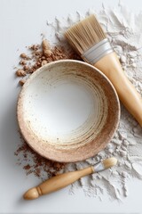 Flat Lay of Ceramic Bowl with Natural Pigments and Brushes – Earthy Artisanal Still Life