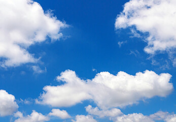 White clouds scattered in the clear blue sky. Sky and clouds landscape. Sky background
