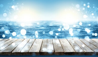 Wooden deck over tranquil ocean with bokeh lights