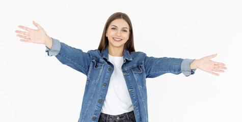 Portrait of a happy young girl with outstretched hands to embrace you isolated on a white background. Woman wants to hug you.