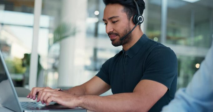 Laptop, support and typing with man in call center for advice, online help or virtual assistance. Computer, conversation and feedback with coworking agent in workplace for contact or customer service