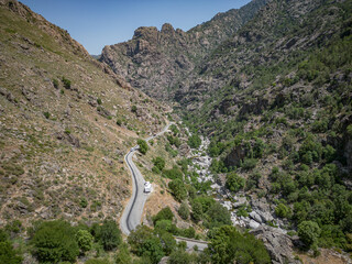 Camping Caravan driving through Canyon de la Ruda road Corsica down the pass monte Cino