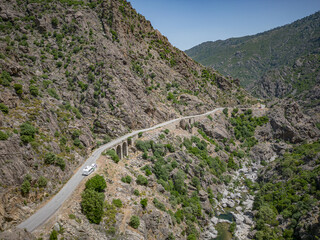 Camping Caravan driving through Canyon de la Ruda road Corsica down the pass monte Cino