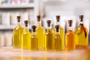 Set fresh craft oil sunflower, cannabis, hemp bottles on store background. Concept eco healthy food shop