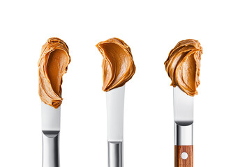 Peanut butter smear on tip of knife, close up. Set of steel cutlery with swirled food texture. Realistic photo for packaging design. Isolated clipart with clear even edge on transparent background