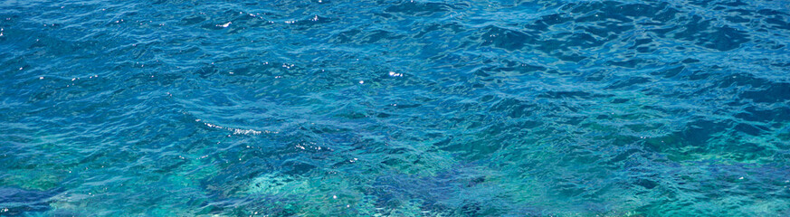 Naklejka premium Turquoise blue ocean water background.Sea aqua abstract texture.Summer,vacation,relax concept banner for design.