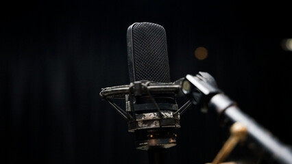 Podcast or Vocal Recording Equipment in Studio Isolated on Dark Background