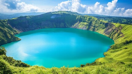 Naklejka premium Vibrant Turquoise Crater Lake Surrounded by Lush Green Hills