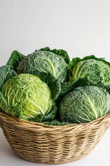 Fresh Green Cabbages in a Woven Basket on a Light Background