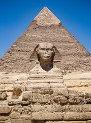 Great Sphinx against the background of the pyramid of the pharaoh Cheops, Giza, Egypt