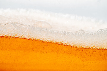 Close up bright orange Oil or beer splash texture and nature waves, Beautiful waves curve and...