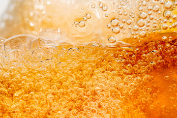 Close up bright orange Oil or beer splash texture and nature waves, Beautiful waves curve and...