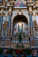 A view of the Temple of Minerva and the adjacent medieval clock tower in the historic center of...