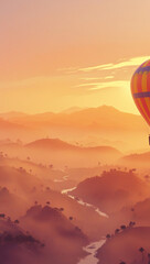 Fototapeta premium A hot air balloon drifts over a misty valley at sunset. Rolling hills, a winding river, and a warm orange sky create a serene, dreamy scene.