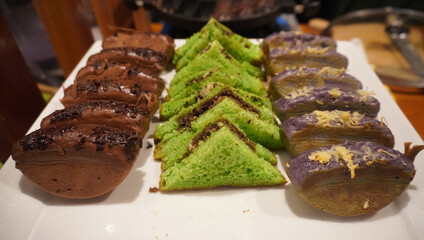  Irresistible Indonesian Snacks: Warm Pukis and crispy toasted sweet bread, a delightful pair....