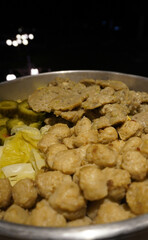 Authentic Siomay: Steamed fish dumplings, a popular Indonesian street food, in a container