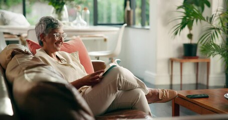 Laugh, senior woman and reading book in home for funny story, info or literature. Sofa, elderly and happy person with novel for fiction bestseller, peace or relax with hobby for humor in retirement - Powered by Adobe