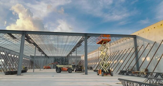 Development of commercial real estate in USA. Construction works on monolithic frame at large building site of logistics distribution warehouse
